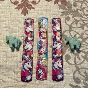 Unicorn bundle- 3 slap bracelets 15’ long & 2 blue unicorn erasers never used.